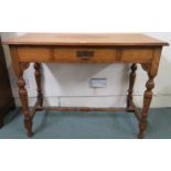 A 20th century oak single drawer buffet side table on turned stretchered supports, 78cm high x