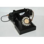 A vintage black Bakelite telephone Condition Report:Available upon request