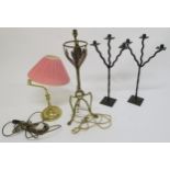 A brass and copper arts and crafts style table lamp, two three branch candelabrum and a contemporary