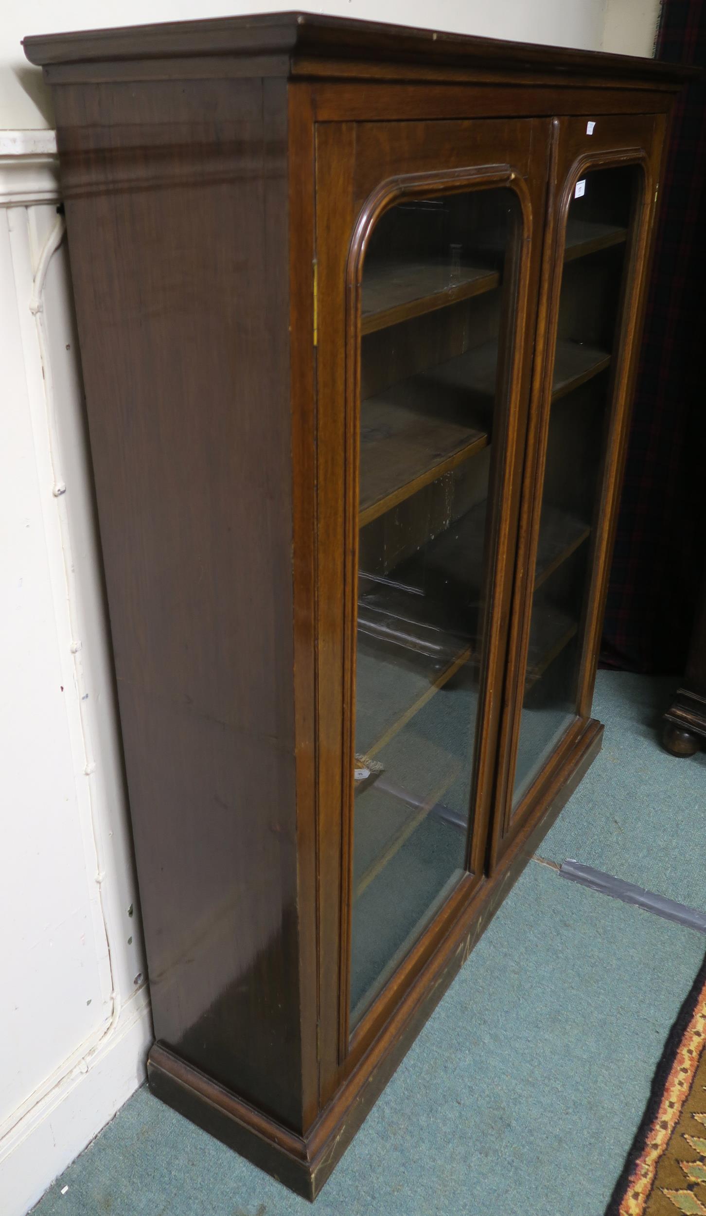 A 20th century stained oak glazed two door bookcase, 147cm high x 127cm wide x 32cm deep Condition - Image 3 of 5