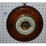 An Edwardian inlaid circular barometer, 20cm diameter  Condition Report:Available upon request