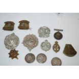 A lot comprising a WW1 War medal to 193303 Dvr A Walker RA, assorted military badges and three