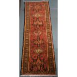 A terracotta ground Karajeh runner, 200cm long x 70cm wide Condition Report:Available upon request