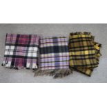 A selection of modern tartan travel blankets (7) Condition Report:Available upon request