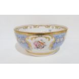 An English porcelain bowl, the pale blue ground gilt decorated and hand painted with  floral sprays,