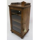 A Victorian walnut glazed music cabinet with fretwork gallery top, 94cm high x 46cm wide x 38cm deep