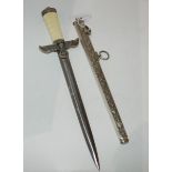 A replica WW2 style German political leader's dagger in scabbard 41 cm o/all length Condition