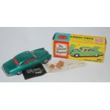 A Corgi No. 238 Jaguar Mk X comprising of metallic sea green body with red interior and spun hubs,