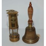 A brass hand bell and E. Thomas & Williams Ltd Cambrian lamp (2) Condition Report:Available upon