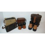 A pair of vintage binocular, another pair, folding camera etc  Condition Report:Available upon