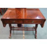 A 20th century mahogany drop end sofa table, 76cm high x 145cm wide x 56cm deep Condition Report: