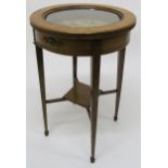 A 20th century oak circular bijouterie table on square tapering supports, 73cm high x 49cm