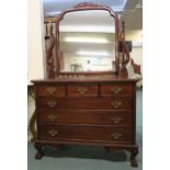 A 20th century mahogany three over three mirror back dressing chest on ball and claw supports, 187cm