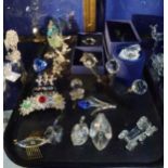 A collection of Swarovski items including butterflies, flowers, starfish, heart, bottle stoppers and