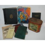 A box of various books, advertising tin etc Condition Report:Available upon request