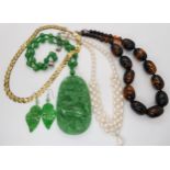 Chinese green hardstone pendant and earrings, cultured pearls and other items in a mother of pearl