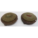 A pair of Victorian walnut circular footstools, one with tapestry upholstery depicting a dog and the