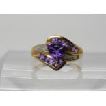 A 9ct gold amethyst and diamond accent dress ring, size N1/2, weight 3.2gms Condition Report: