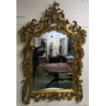 A 20th century gilt Rococo style wall mirror, 165cm high x 110cm wide Condition Report:Available