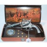 A single action Colt Army 45 replica in box and a small pellet gun Condition Report:Available upon