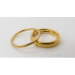 A 22ct gold wedding ring with Birmingham hallmarks for 1870, size L, weight 6.7gms, together with