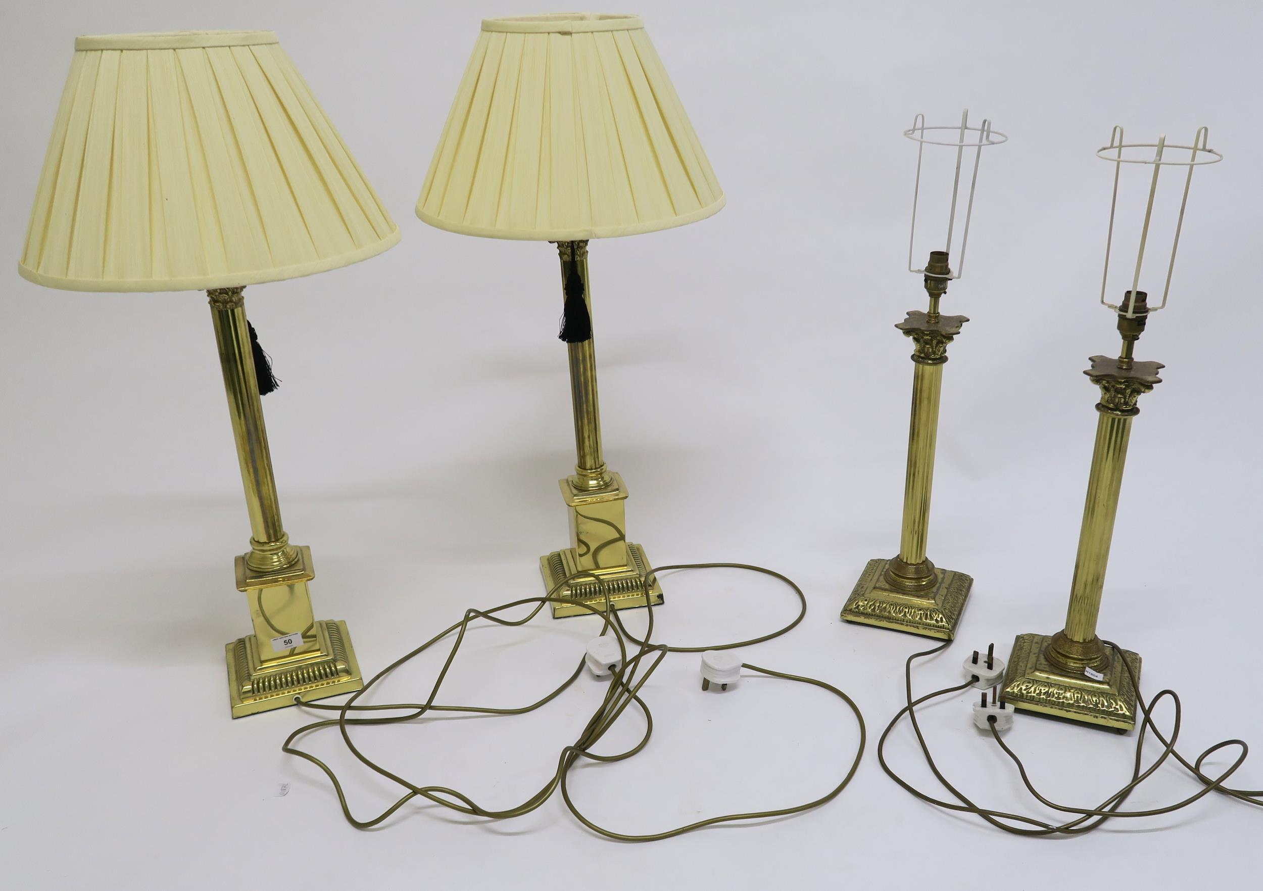 Two pairs of contemporary brass Corinthian table lamps (4) Condition Report:Available upon request
