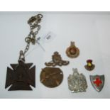 A quantity of military badges with a British WW1 Propaganda Iron cross Condition Report:Available