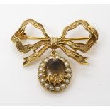 A 9ct gold bow brooch set with smoky quartz and pearls, dimensions 3.5cm x 3.3cm, weight 7.8gms