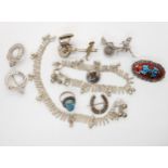 Two white metal Rickshaw brooches, a Scottish silver thistle brooch and other items Condition