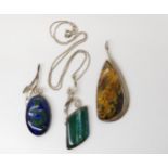 Three American designer pendants made by Tom Burns of Vermont, all three signed, to include blue and