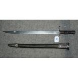 An American bayonet by Remington, the blade stamped, in metal scabbard Condition Report:Available