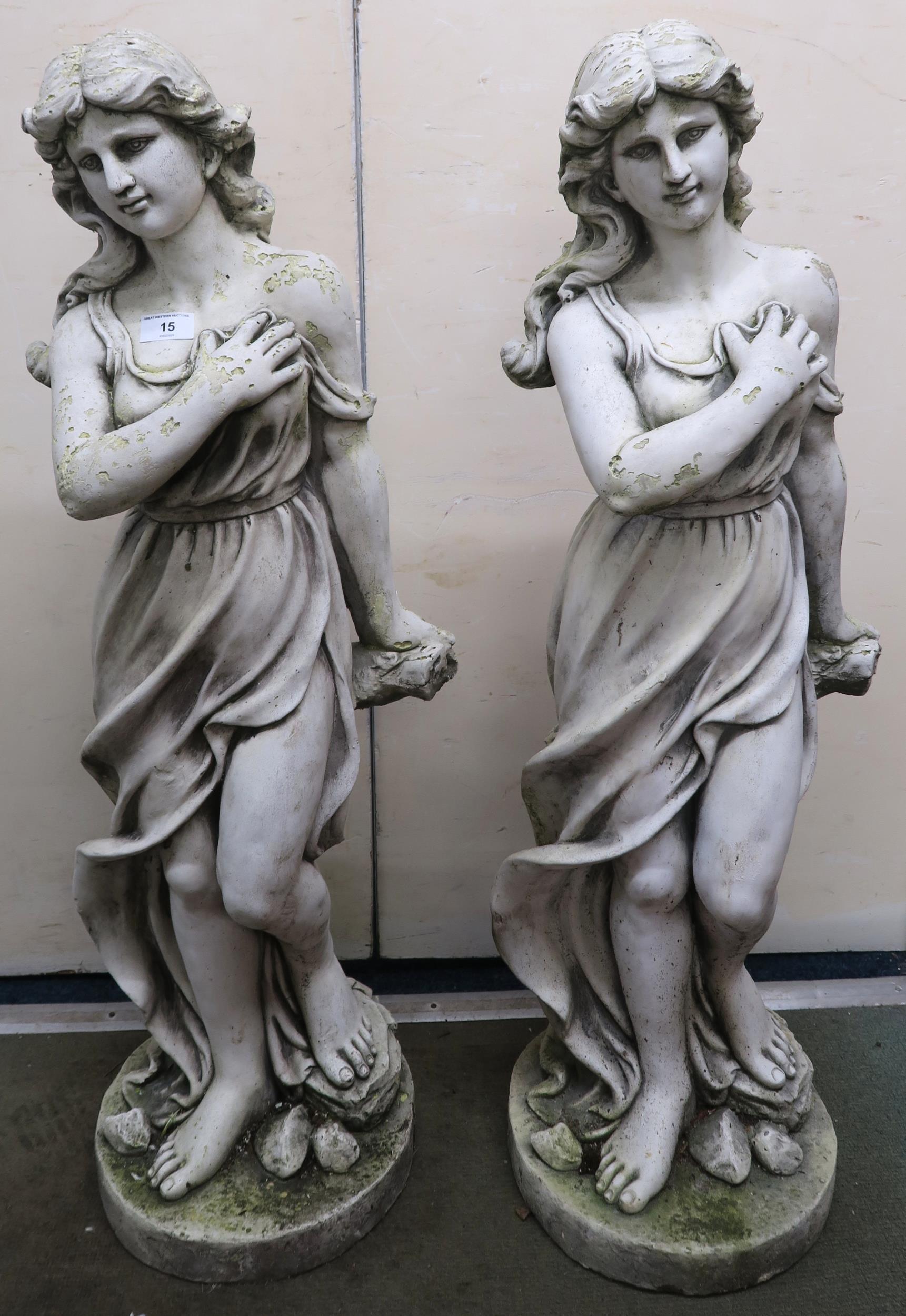 A pair of contemporary stoneware figural statues of ladies (2) Condition Report:Available upon