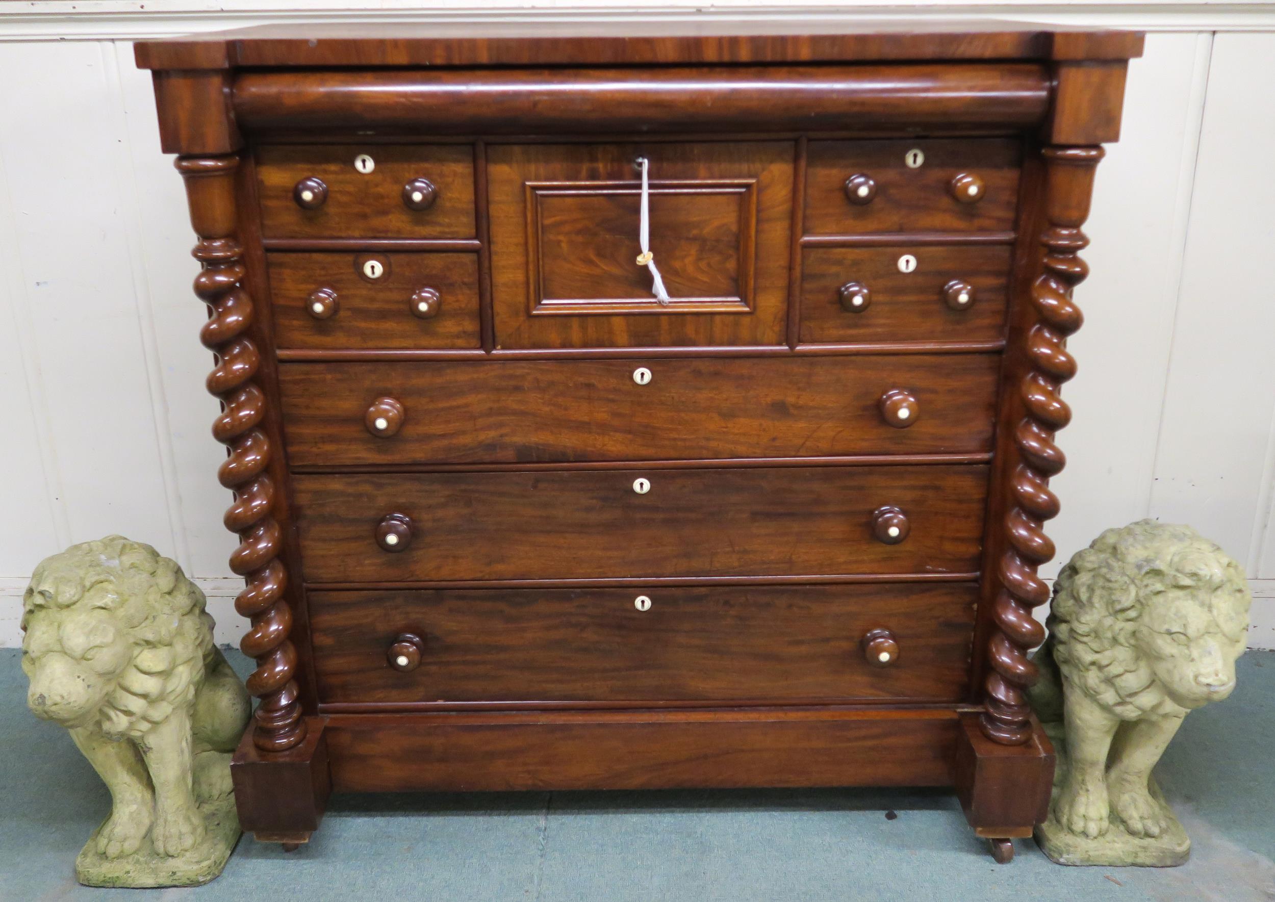A Victorian mahogany "Scotch" chest of drawers with four above three drawers flanked by barley twist