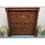 A Victorian mahogany "Scotch" chest of drawers with four above three drawers flanked by barley twist