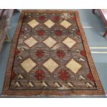 A Shiraz rug with stylized horse head design 290cm x 206cm Condition Report:Available upon request