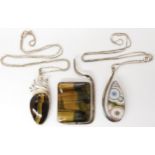 Three American designer pendants made by Tom Burns, all three signed to include tiger's eye,