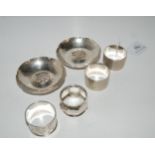 A pair of silver napkin rings, two other silver napkin rings and a pair of Habis silver-plated