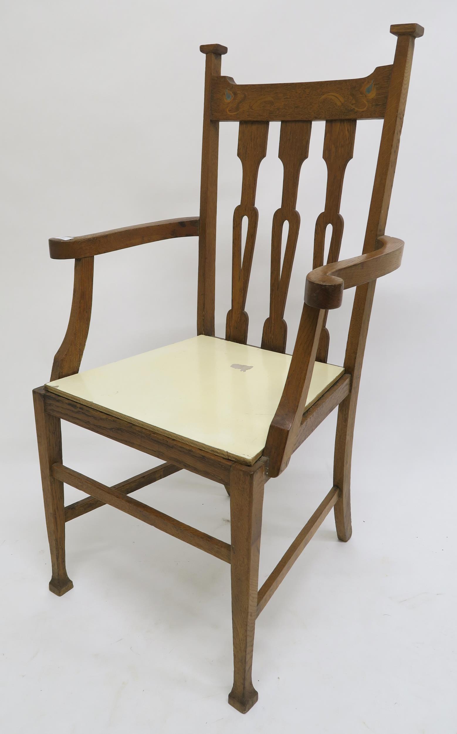 A Victorian oak arts & crafts inlaid armchair Condition Report:Available upon request