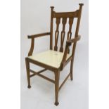 A Victorian oak arts & crafts inlaid armchair Condition Report:Available upon request