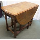 An early 20th century oak drop leaf table, 74cm high x 121cm wide x 91cm deep Condition Report: