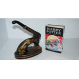 A vintage desk embosser and a Harry Potter and the Deathly Hallows, hardback Condition Report: