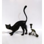 A bronzed metal cat and a cold painted candlestick of a frog lifting a dumbbell Condition Report:
