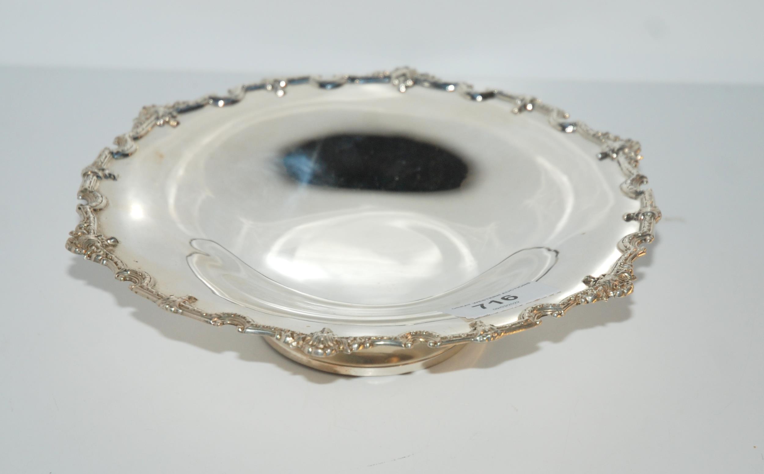 A silver circular dish, Birmingham, 1961 by decorative border, 23cm wide Condition Report: