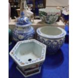 A blue and white Chinese jar and cover, a fish bowl, a hexagonal planter and a bowl with pointed rim