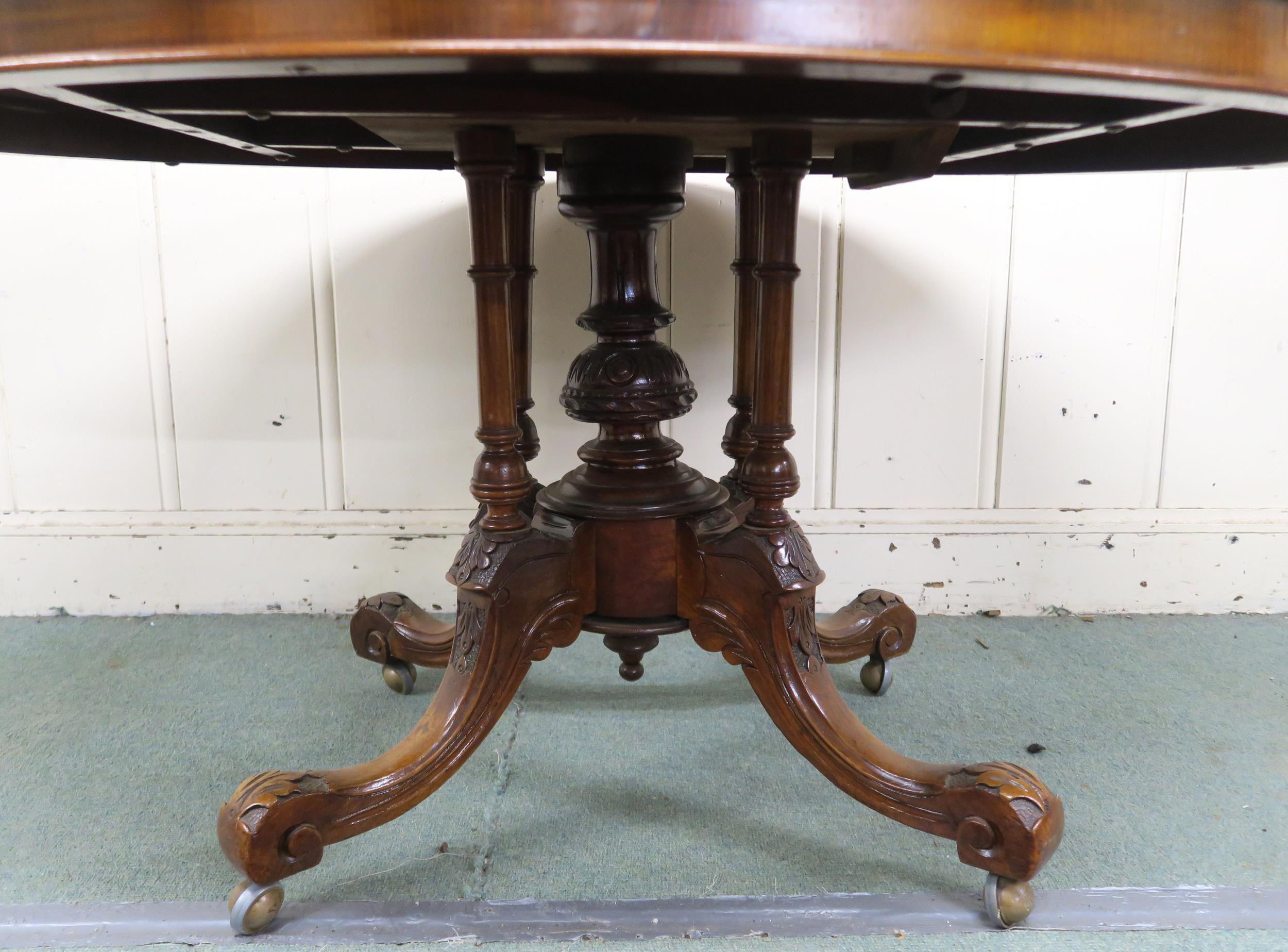 A Victorian burr walnut inlaid oval tilt top breakfast table on carved quadrupedal base, 74cm high x - Image 3 of 7