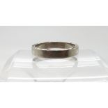 A platinum wedding ring with diamond accents set to the edge, five diamonds to each side, size X,