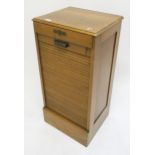 An early 20th century oak tambour front filing cabinet, 92cm high x 45cm wide x 39cm Condition