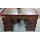 A 20th century mahogany pedestal desk with green leather skiver, 75cm high x 122cm wide x 61cm