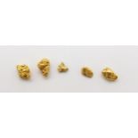 Five gold nuggets, weight 2.8gms Condition Report:Available upon request