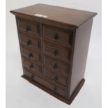 A Victorian stained oak nine drawer apprentice chest, 45cm high x 37cm wide x 22cm deep Condition